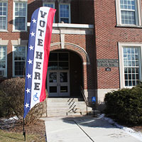 Deluxe Feather Flag marks polling place entrance for disabled voters.